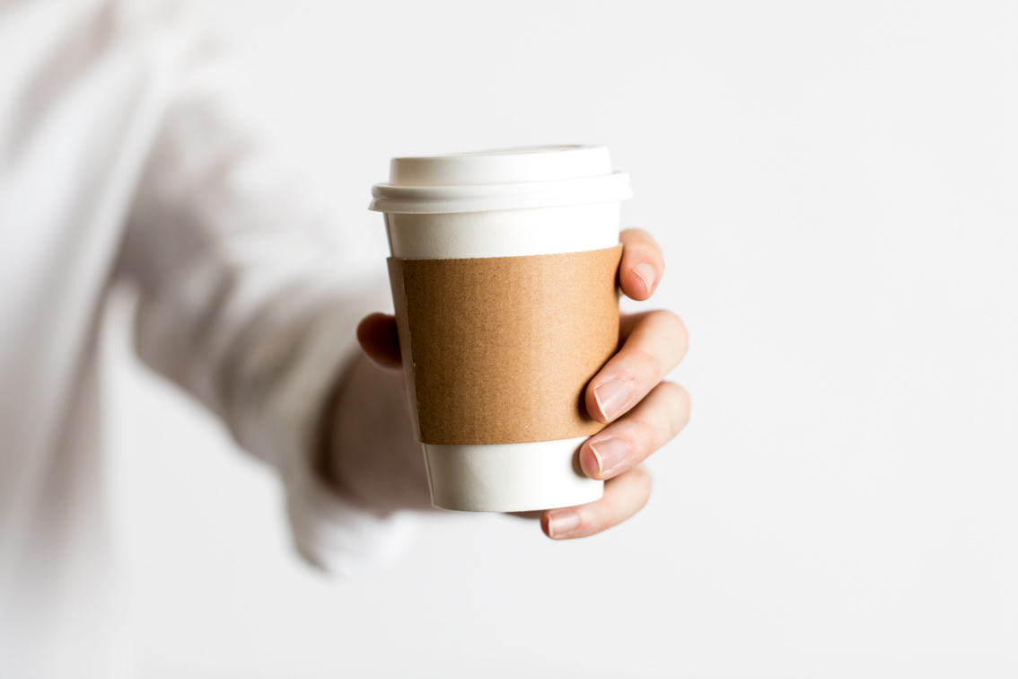 Coffee Cup To Go Being Held